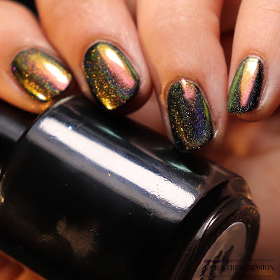 Swatch of Born Pretty Store peacock holographic nail powder item #40683 over black nail polish