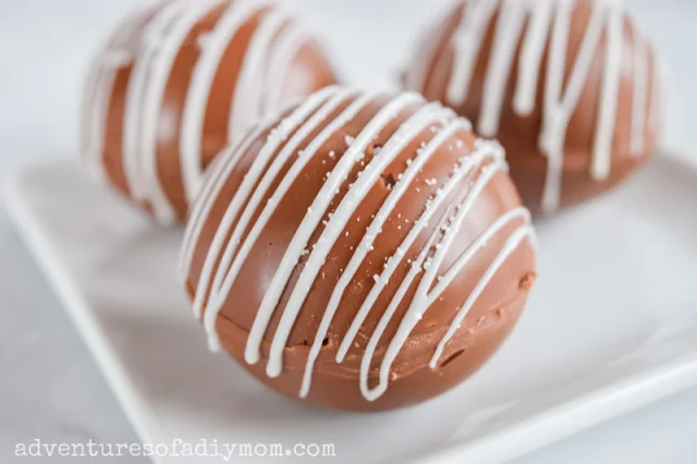 salted caramel hot chocolate bombs on a plate