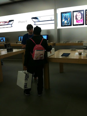 guy wears hello kitty backpack