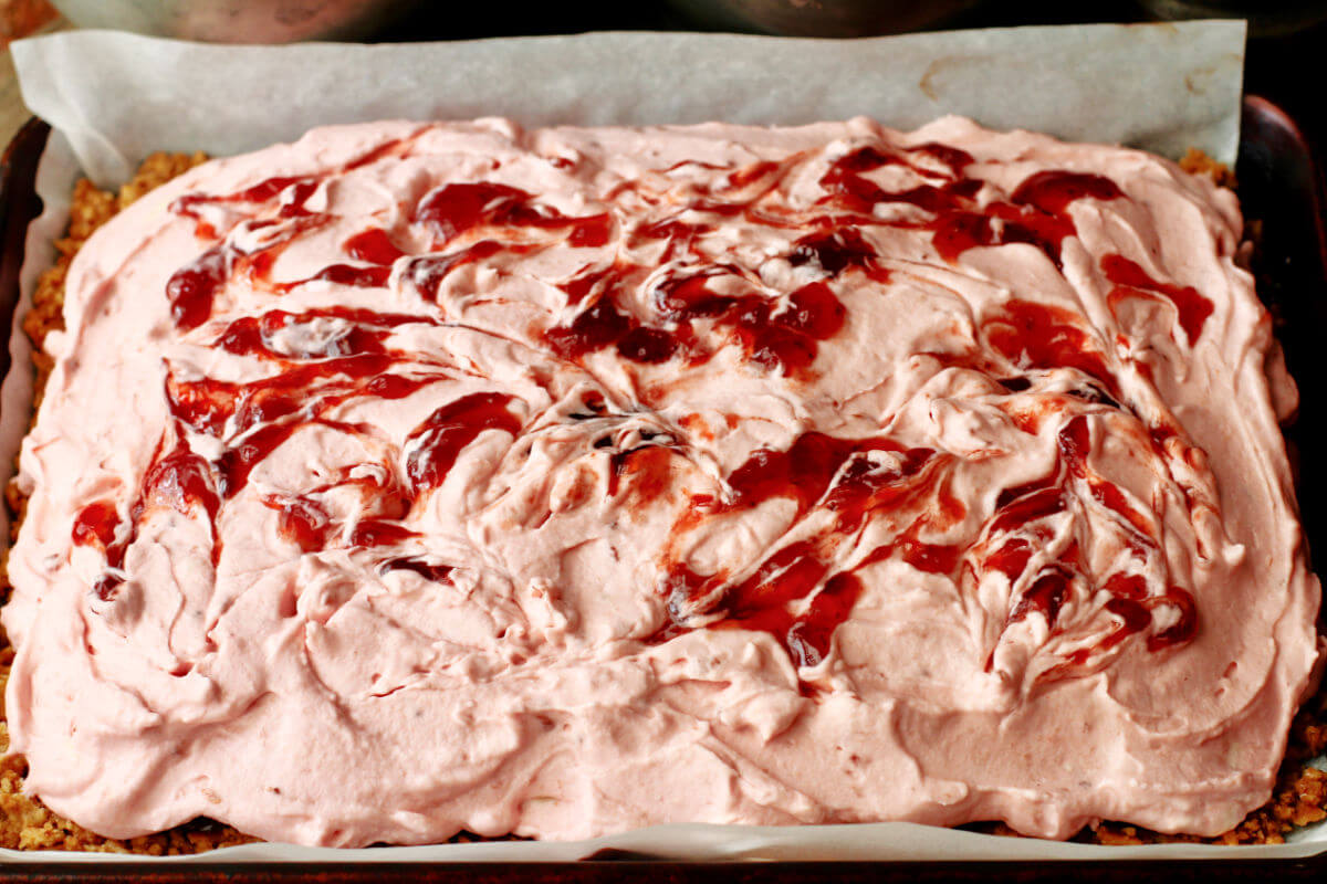 Strawberry whipped cream and cream cheese topping.