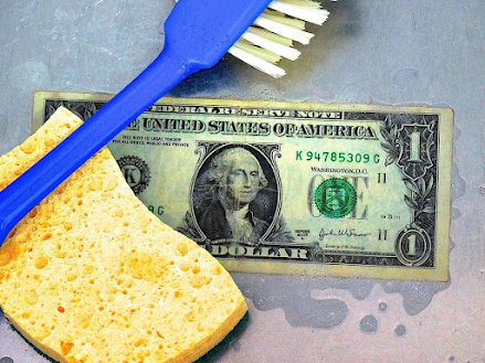 Paper bill with a sponge and a toothbrush