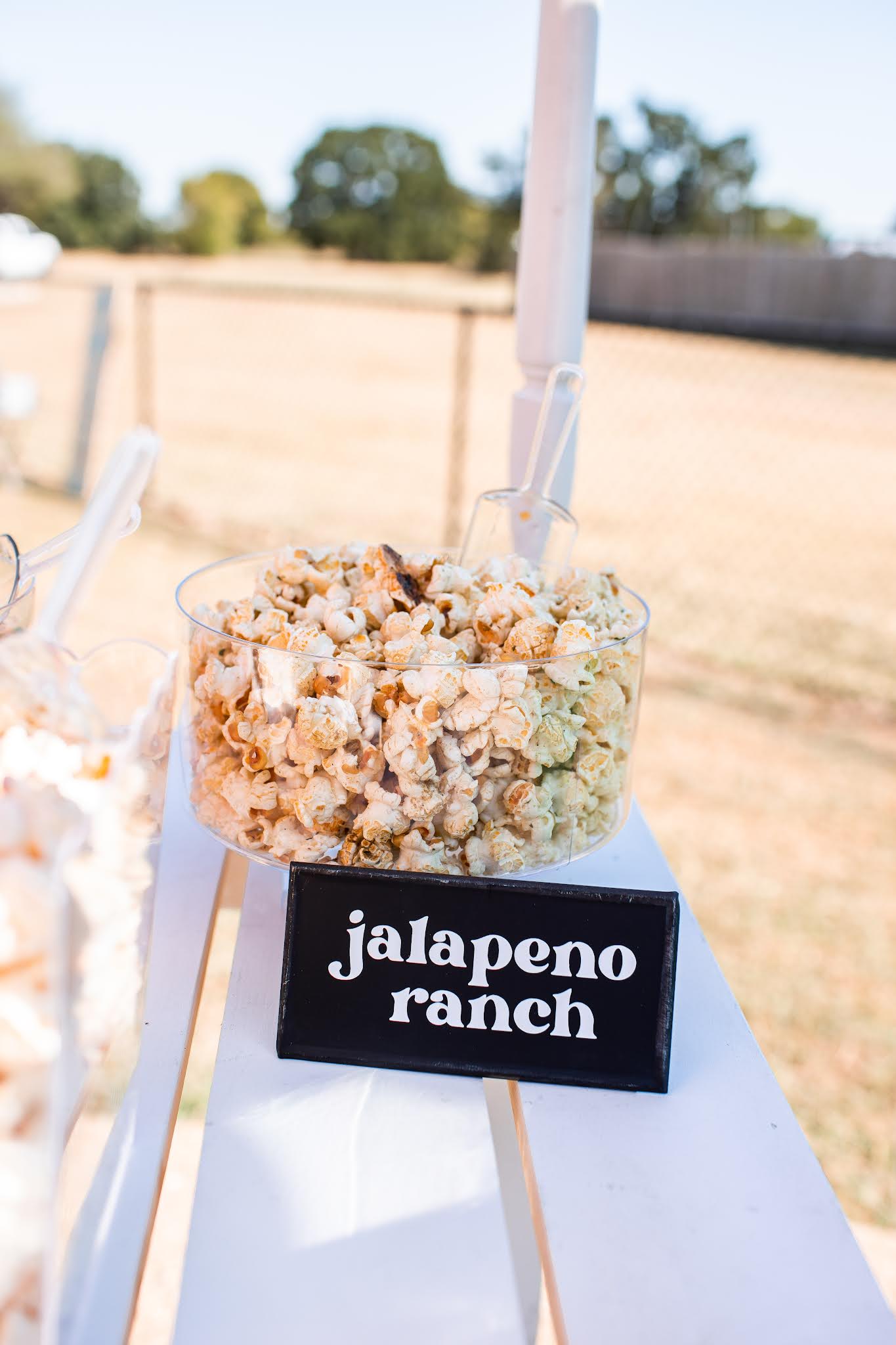 Gourmet popcorn stand DIY signage and clear acrylic table setting