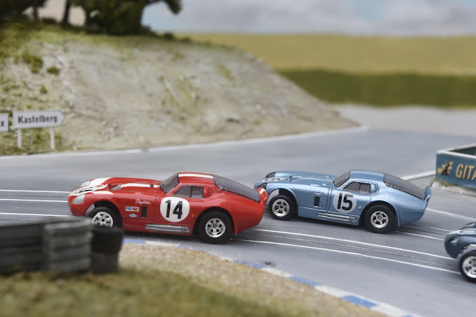 Two custom Shelby Cobra Slot Cars on a highly detailed slot Car Track