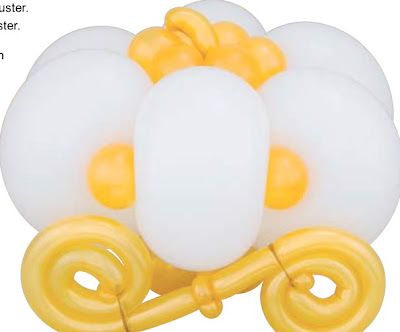 Let's not forget the table centerpieces like this balloon pumpkin carriage