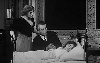 Florence Lawrence, Frank Powell, and Gladys Egan in "The Country Doctor" (1909)