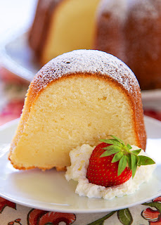 5-Flavor Pound Cake Recipe - homemade pound cake with tons of great flavor - Vanilla, Rum, Coconut, Butter, and Lemon -  highly recommend serving it with some vanilla ice cream and fresh berries way at your Memorial Day cookout.