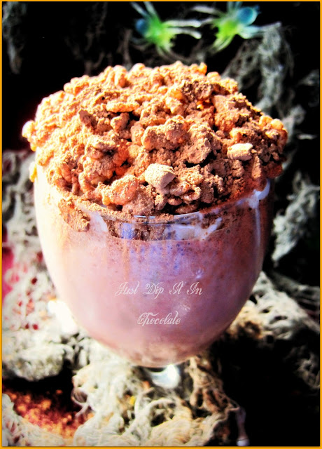 Graveyard Mud Halloween Brownie Milkshake Recipe, This is the most delicious dirt you've ever had! Chunks of brownies and nuts on this shake you will probably need a shovel...oops, a spoon, to dig them out!