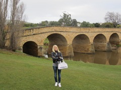 Posing in front of old bridge