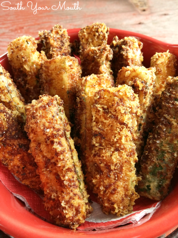 Crispy Fried Zucchini - A simple recipe for crispy fried zucchini spears dredged in grated parmesan cheese and Italian bread crumbs then lightly fried in olive oil.