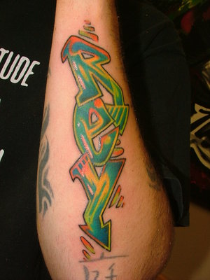 The next graffiti design is a graffiti tattoos style on body,