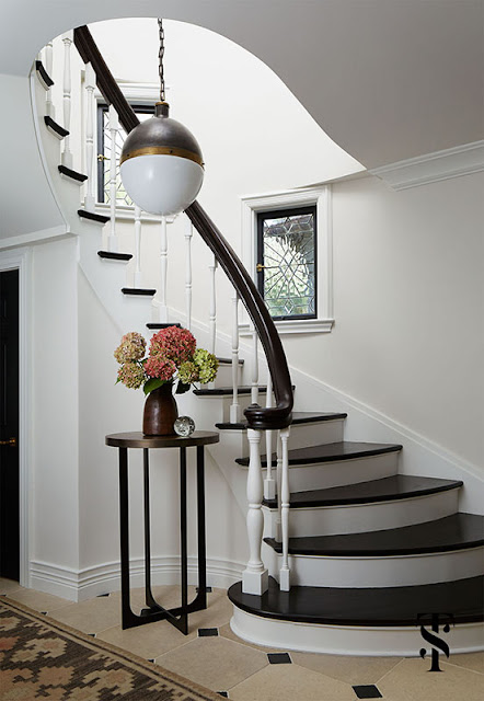 Stairway with sculptural architectural detail and Classic Decor in French Tudor Renovation by Summer Thornton on Hello Lovely