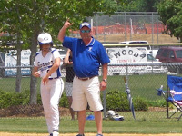 Coach Harris signals for courtesy runner for Kimmie Stewart who was hit by a pitch