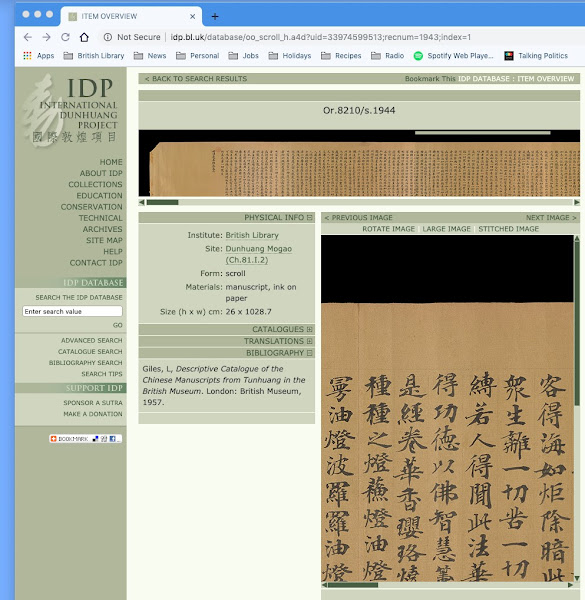 Screen shot with light blue frame showing website with yellowish-grey bar left side bar, white background, images of yellowed scrolls with Chinese characters on them and a greyish yellow text box.