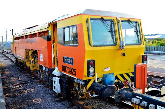 photo of uk railway track tamper machine DR73925 'Europa' on sidings at Ely railway station 2014