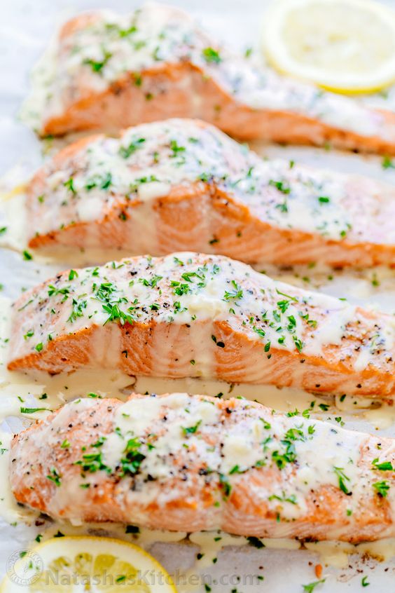 This oven baked salmon is drizzled generously in a simple and delicious lemon cream sauce (classically known as lemon beurre blanc). The sauce will become your secret weapon for seafood recipes. It’s great with salmon, scallops, crab cakes and all kinds of fish. It is easy to make and brings so much amazing flavor.