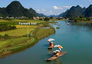 Farmers trail near Yulong river.