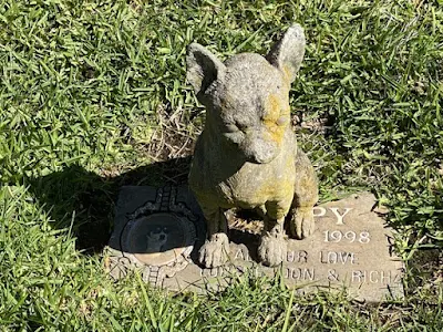 statue and gravestone at Bubbling Well Pet Memorial Park in Napa, California