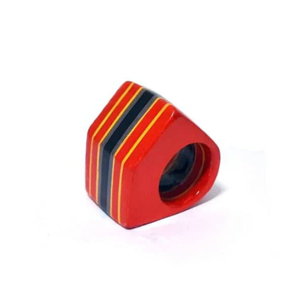 modern ring made with red, yellow, grey, and black paper layers