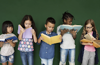 5 elementary students reading books