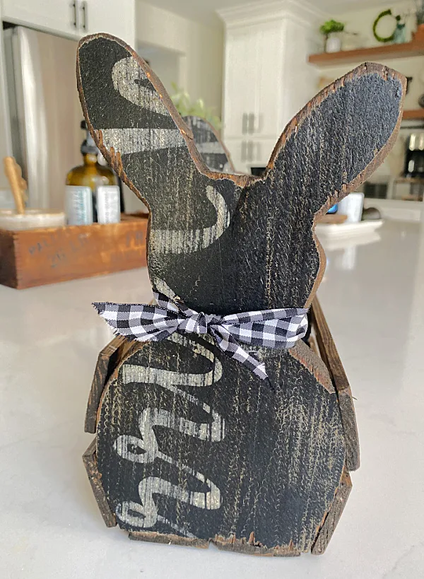 wooden bunny with writing and bow