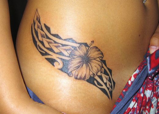 arowana tattoo. flower side tattoos.