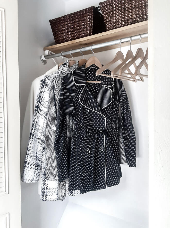 Closet with black and white coats
