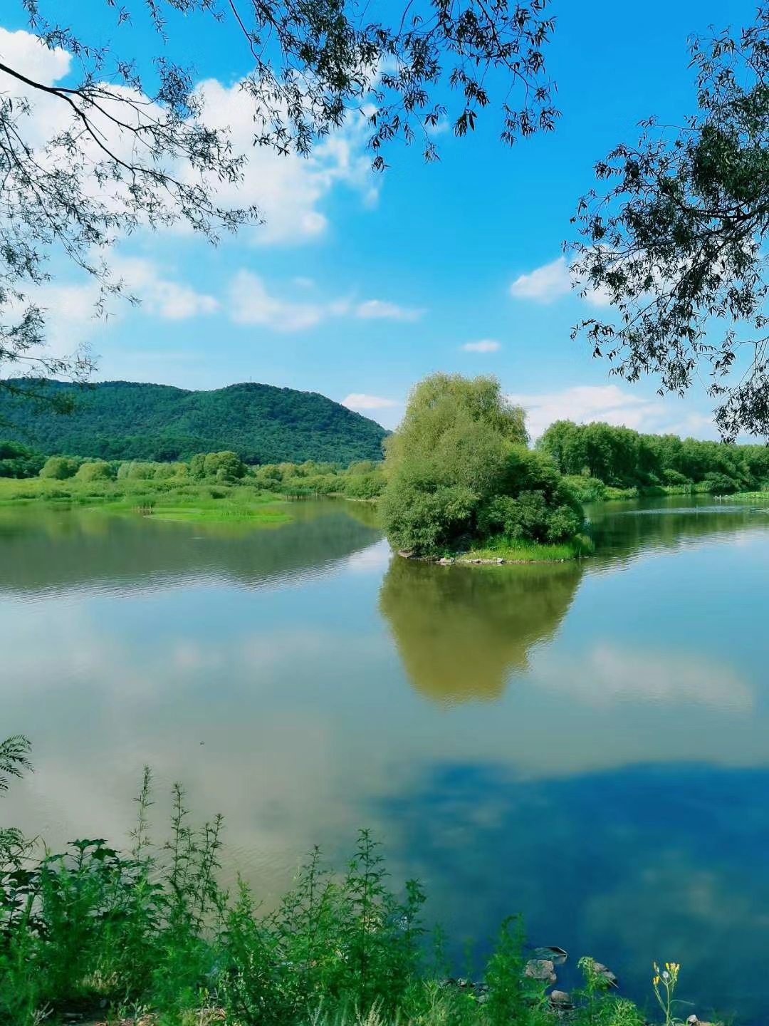 Travel photograph landscape of magnificent mountains, tranquil water, clear sky