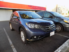 Scraped bumper on 2013 Honda CR-V before repairs at Almost Everything Auto Body.