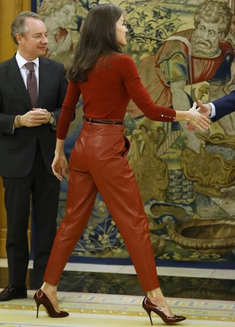 Queen Letizia wore a red frankie cuff detail wool sweater by Hugo Boss, and red leather trousers by Hugo Boss