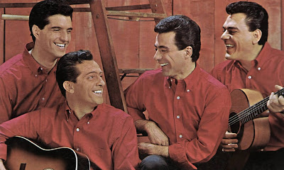 Original Four Seasons singing group color  photo wearing reddish brown shirts against a matching background shi