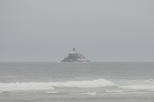 Tillamook Rock Lighthouse slightly in the distance in the Pacific Ocean.