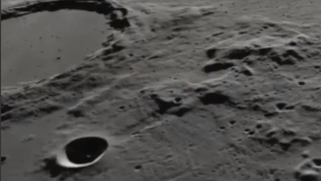 White craft in Moon crater in NASA footage.