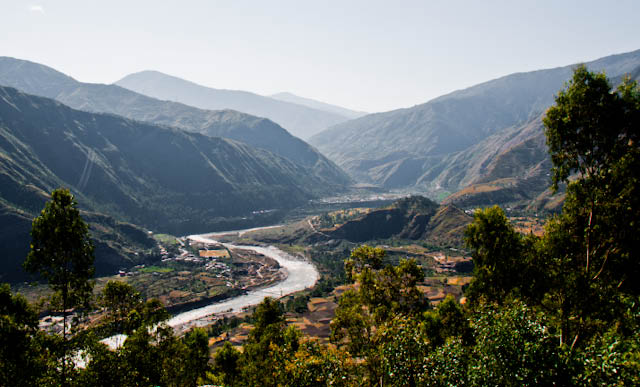 Beautiful Journey till Baghipul on third day of MTB Himachal 2010 : Posted by VJ SHARAMA on www.travellingcamera.com : On third day, we had lunch at a very beautiful place which was situated on a very high mountain on the way to nirmand... We had a 30 minutes break for lunch and moved for next milestone... Some part of this road was really scary and beautiful as well.. Just have a look at some of the photographs clicked post lunch and this journey completely at baghipul.. but that was not the last destination.. everyone had to ride the bikes for 12 kilometers.. It was free ride but it took a lot of time because of the rough road till Kullu Sarahan...All such seens were very scary but as I have mentioned many times that we learnt over the time that riders are much more efficient & alert as we used to think... They had full control in spite of amazing speed on these roads... Be it a downhill or an uphill, they were simply amazing... Many times it was frustrating for photographers because our van was not able to catch up with their speed...Shadows are telling about the time and now its less than 1/4th of the stretch but most time consuming, especially Baghipul to Sarahan Village... I hope you noticed snow covered hills in the background :)A new road, just created by Patel Contructions Ltd.. There was a huge project going on near the Satluj River... Lovely views from this place and we couldn't afford to have a break and shot the beauty there.. All these photographs have been clicked from a moving van....Beautiful landscapes but no time to shoot them :( .... Whole group had to be very fast because we needed more time during the last stretch where we had to climb a hill with the slope of 70 degree and it was 12 kilometers from the base site to the main camping area in Sarahan... This place are parallel to Shrikhand Mahadev...Even the peaks with snow cover are a part of Shrikhand mountain range ... One of the popular trek in Himachal Pradesh... Actually it was a pilgrimage site but now a days many trekkers go their to experience amazing beauty of the nature...Roads... 8 days on roads but all were different and more exciting for riders... They always got a new challenge during each day of MTB Himachal 2010...A view of Satluj River from the road which connects Shimla with Nirmand Village or base site for Shrikhand Mahadev(jaon village)...Here is another side of Satluj.. Both the photographs have been clicked from same place... This one is the left side and above one is of right side... wonderful view of Satluj in the middle of very high hills of Himalayas...Another Photograph of Satluj river flowing through Himalayan ranges.. Photograph click during MTB Himachal 2010...Main profession in Himachal - Agriculture and the fields are shining like anything... 