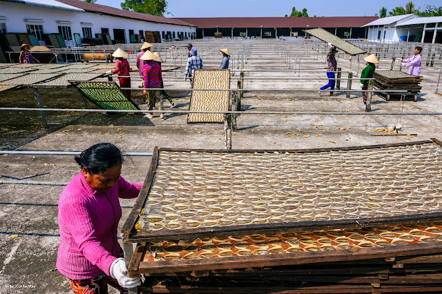 Visiting handicraft village with drying fish