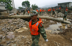 Rescuers working at the dam of the Shenjiakeng Reservoir breached in Zhejiang Province of China