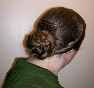 1850s or 1860s hairdo, back view with comb.