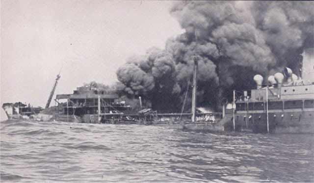 Esso Boston sinking after being torpedoed on 12 April 1942.