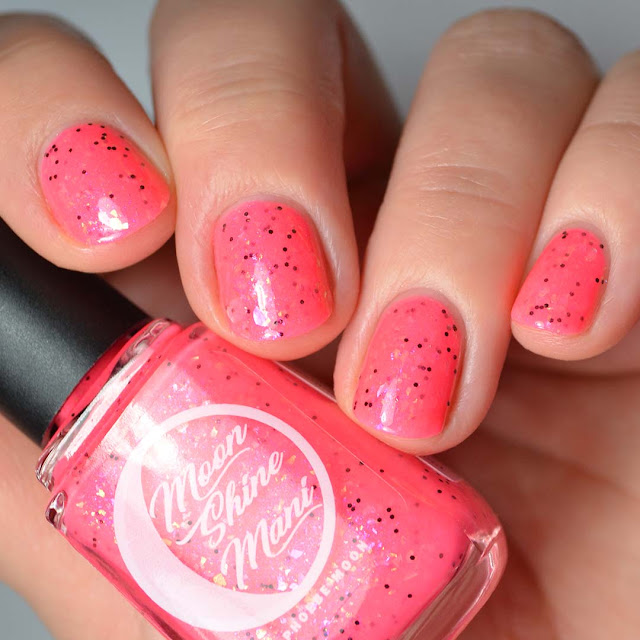 neon pink nail polish with flakies swatch