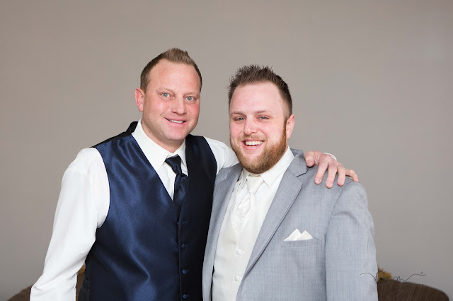 groom getting ready for wedding with best man