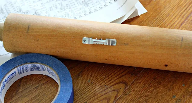 Photo of a sawtooth hanger added to the back of a rolling pin.