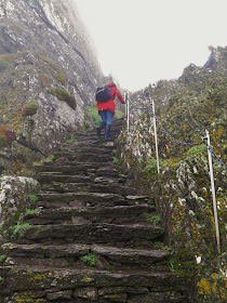 Climbing the stone steps to the top of Skellig Michael, County Kerry, Ireland