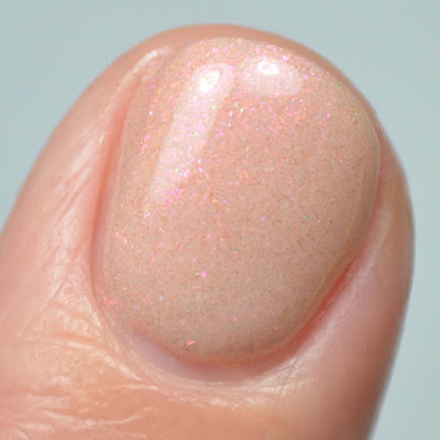 peach shimmer nail polish close up swatch