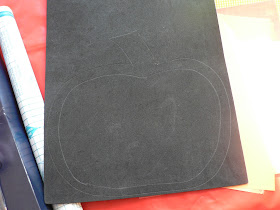 draw a pumpkin shape on black craft foam