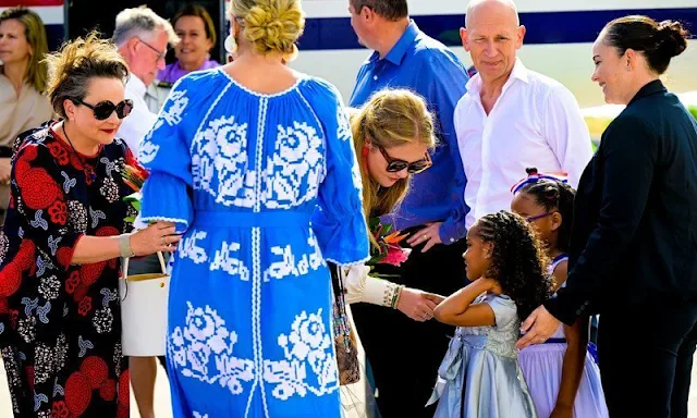 Queen Maxima wore an ocean dress by Foberini. Princess Amalia wore Heidi floral pattern blouse by Fabienne Chapot