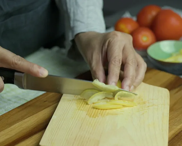 Slice preserved lemon thinly