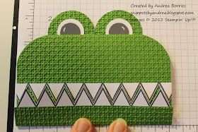 Adhere the eyes to the back of the card.