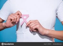 Breast cancer. woman in aerial view holding breast cancer awareness Ribbon, pink