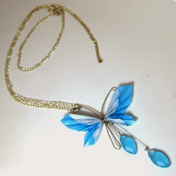 Gold Butterfly Necklace and blue gems are beautiful and attractive