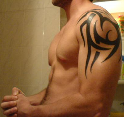 rihanna tattoo shoulder. hawaiian tattoos for men.