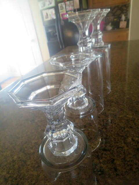 DIY Dollar Store Hurricane Vases--Use dollar store glass vases and candlesticks to make these inexpensive hurricane vases!